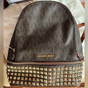 Michael kors  brown backpack pre owned in excellent condition with dust bag